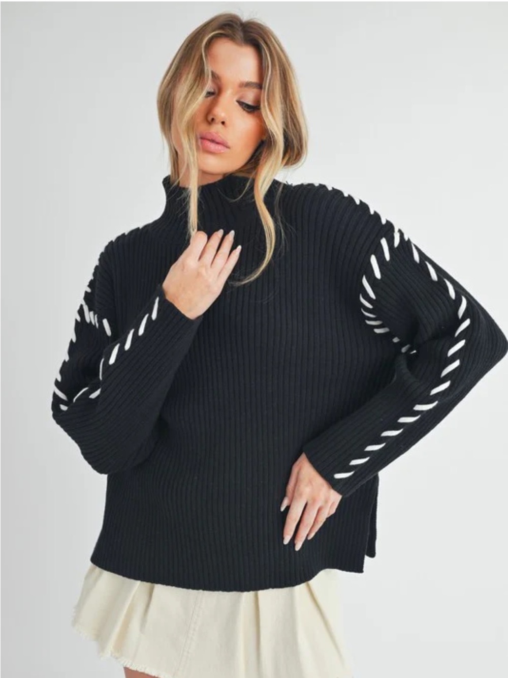 AEMI-CO Georgina Black Ribbed Mock Neck Sweater with White Stitch Detail